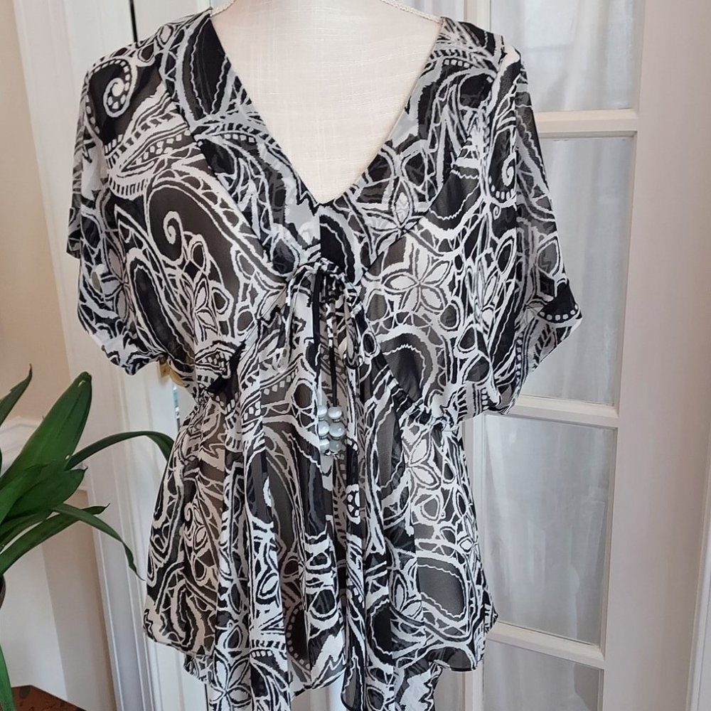 TUNIC-ASYMMETRICAL HEM AND PATTERN